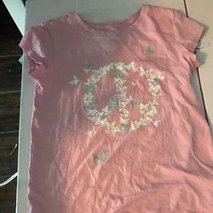 A pink butterfly shirt